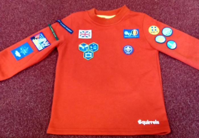 Squirrel uniform with badges